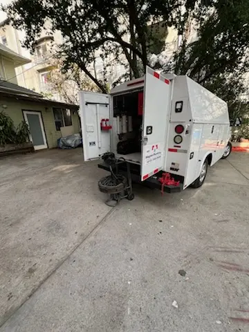 Magnet Plumbing service vehicle on-site for Grease Trap Cleaning in Highland Lake